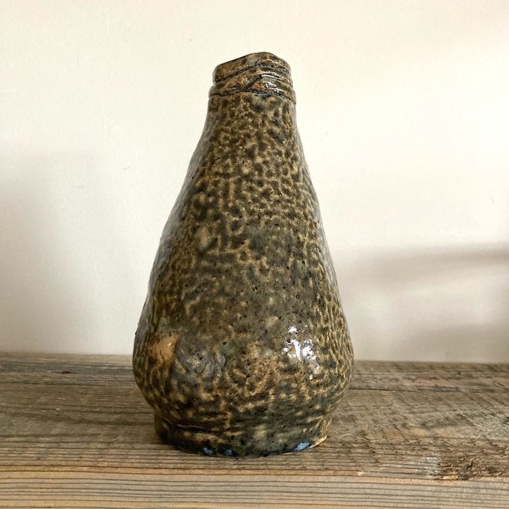 Handmade heavy pottery bottle coiled style
